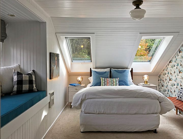 Bedroom No. 3 (third floor) is flooded with natural light thanks to newly installed skylights that blackout with the press of a button. A queen bed, with large window seat and fully remodeled bathroom with shower/tub.