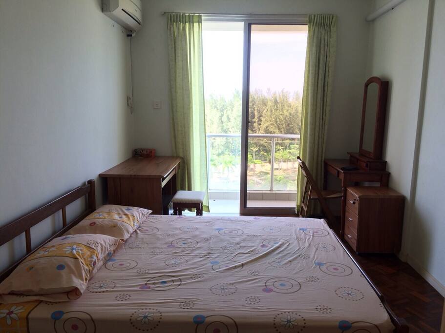 Master bedroom with attached bathroom and balcony, sea view