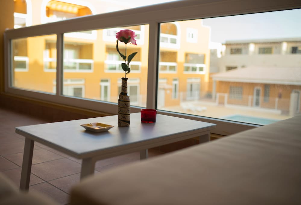 Cozy sofa on the large, private balcony for some holiday relaxation.