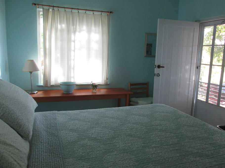 Your room has a queen bed and a door to the patio.
