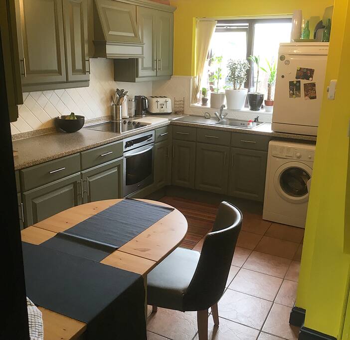 kitchen with four chairs, and everything you would need.