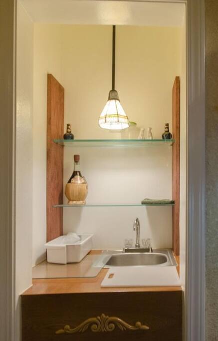 Wet bar complete with a mini frig for your drinks and snack bonus a wine cooler too!!
