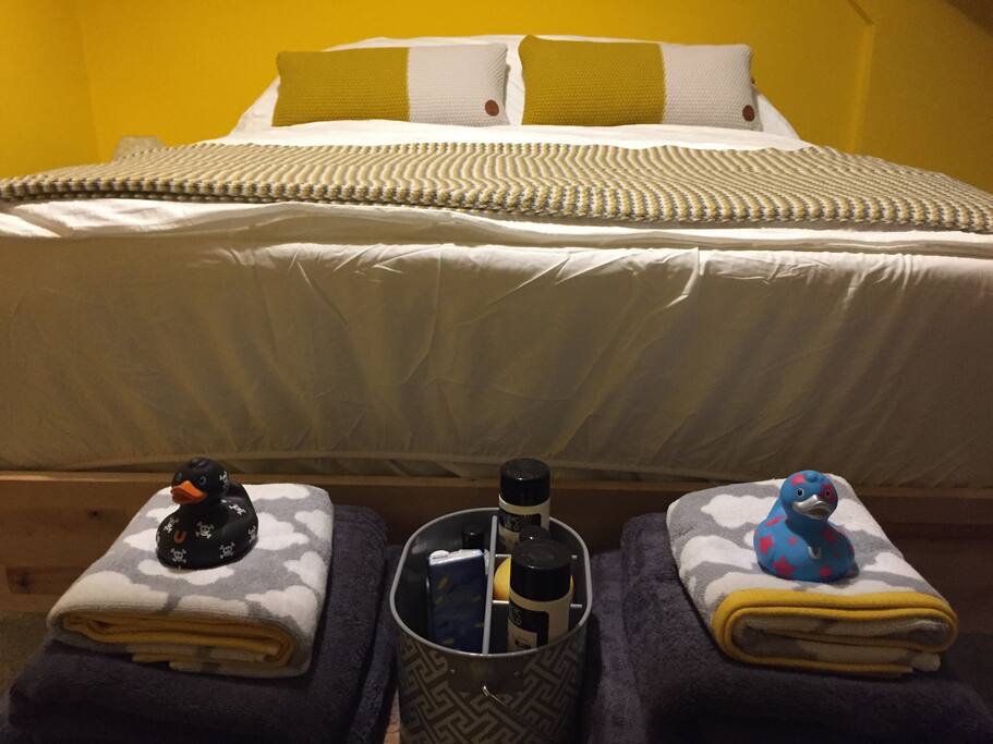 Your snuggly bed, inclusive of fluffy towels and rubber ducky friends.