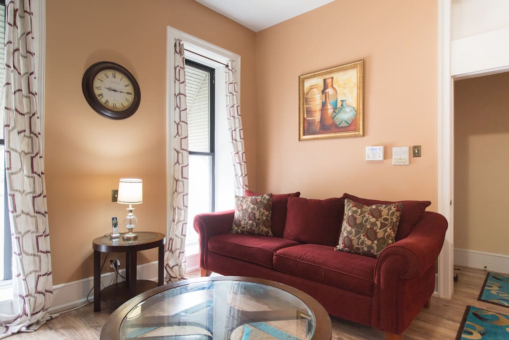 Comfy living room with queen size sofa sleeper flows right into the sitting room with queen sized futon and table that's perfect for card and board games.