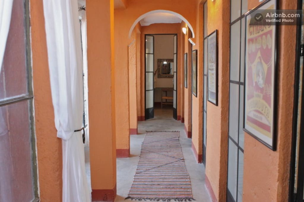 this bedroom is at the end of the hallway