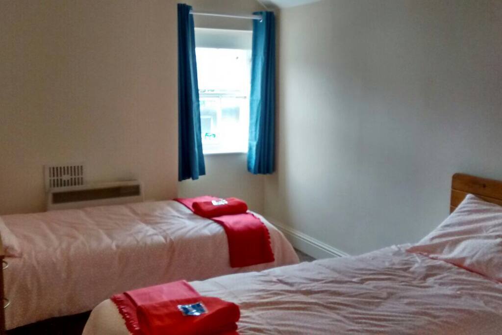 First room with two single beds
