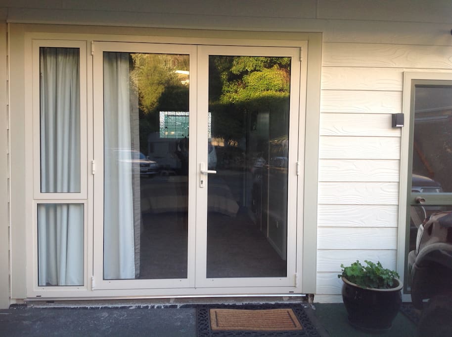 Double glazed French doors lead into unit.