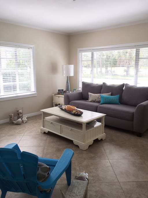"The Cottage" is located in a quite neighborhood with a view of the Country Club golf course. Picture of the living room with Queen pull out sofa. T.V./cable/wifi included.