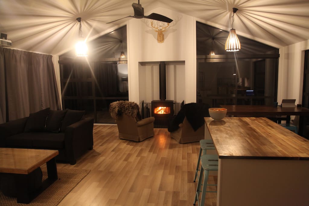 The spacious living room with log fire