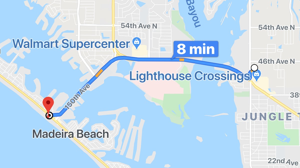 A map illustration displays a route to Madeira Beach from Lighthouse Crossings, indicating a travel time of 8 minutes. Key landmarks such as a Walmart Supercenter are marked, and the surrounding waterways and roads are clearly outlined.