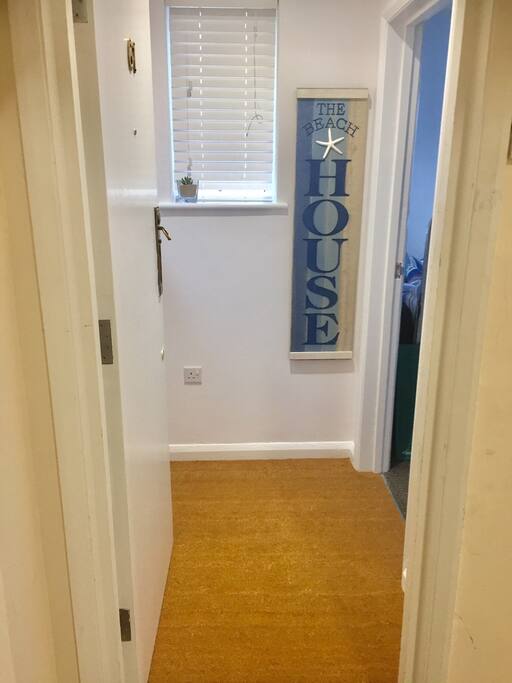 Cloakroom entrance to the Cosy Beach House.
