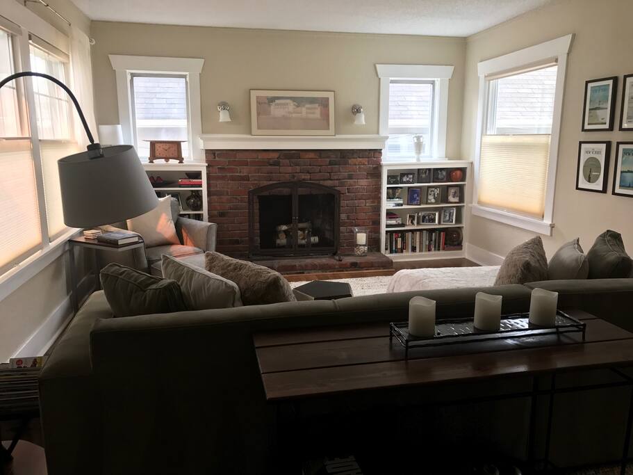 Cozy living room with woodburning fireplace.