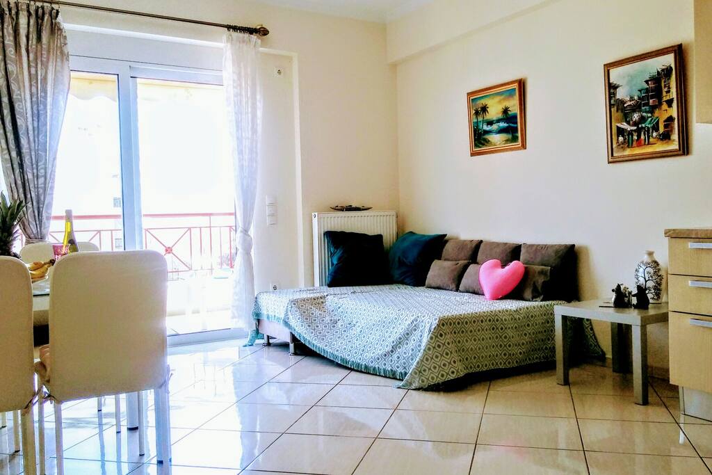 living room with a couch that becomes double bed