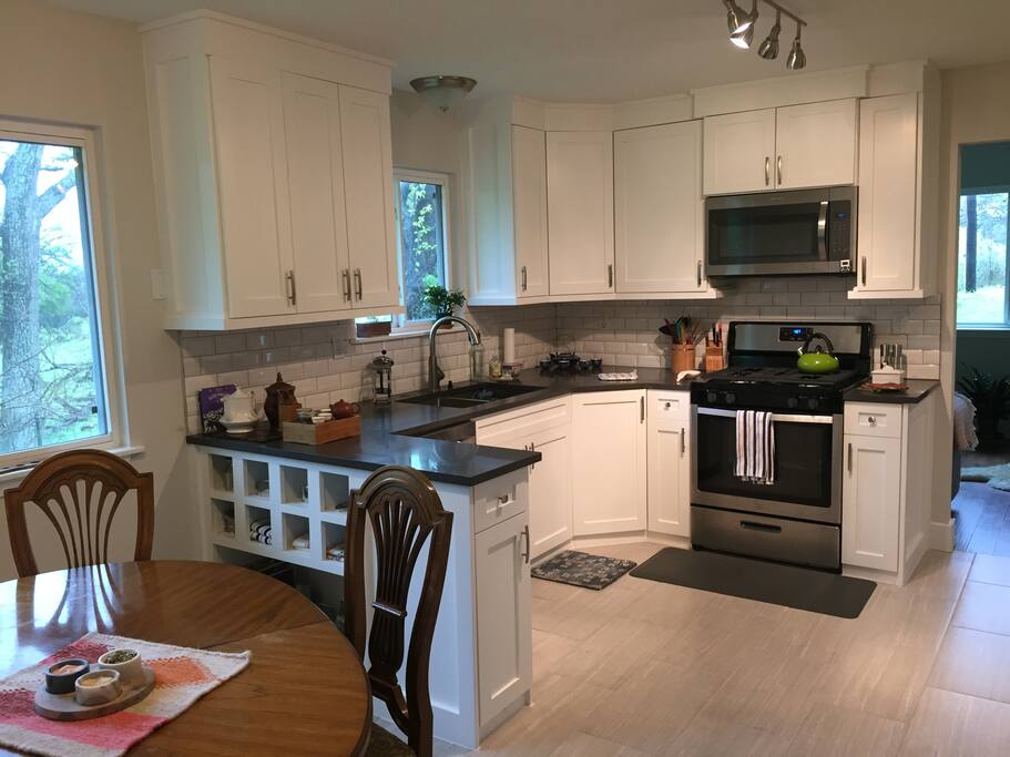 Kitchen has all new appliances. Dining area seats 4