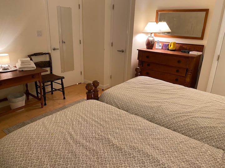 The ground floor bedroom is furnished with good old New England antiques from the owner’s family.