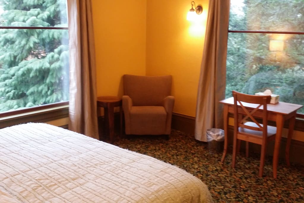 Sitting area & desk, large windows with views