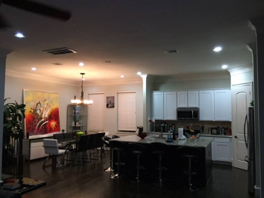 Kitchen Table seats 8 with buffet Island has 6 bar stools. More chairs in the garage.