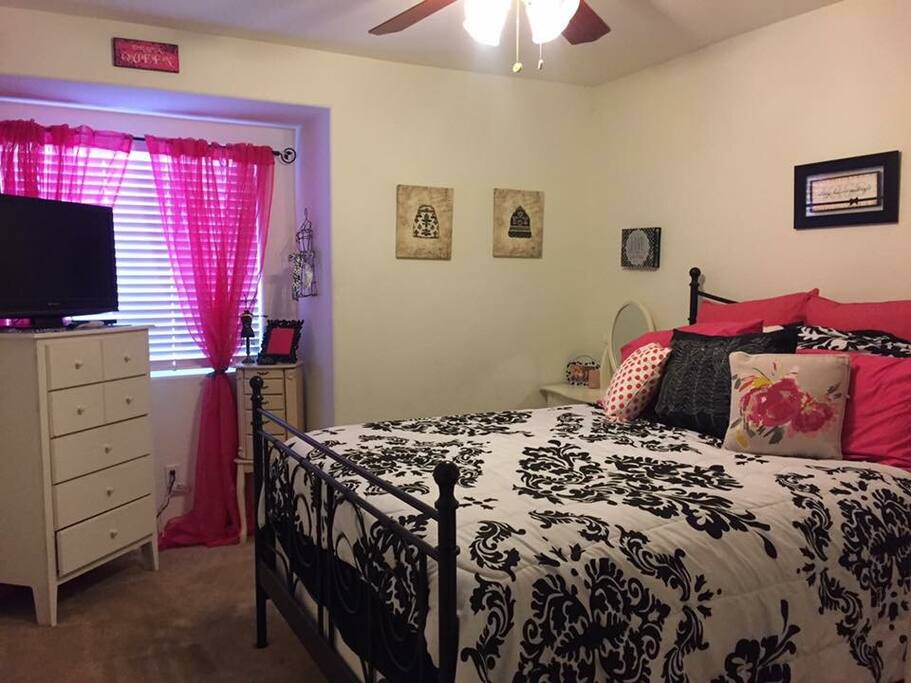"Pink Room" features a queen size pillow top mattress. TV and cable box included.