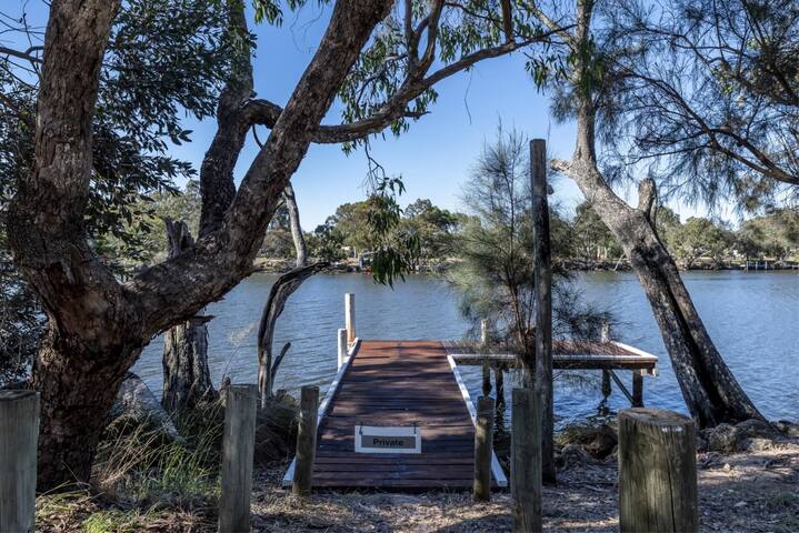Absolute riverfront modern home, private jetty.