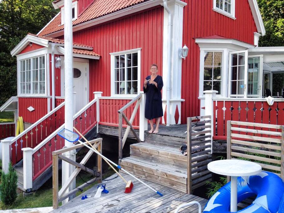 The house in summer time with the stairs to the terrace.