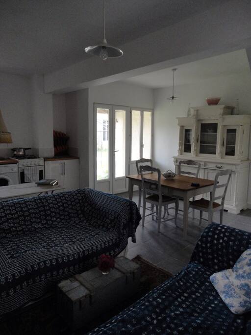Dining area with doors out to courtyard garden