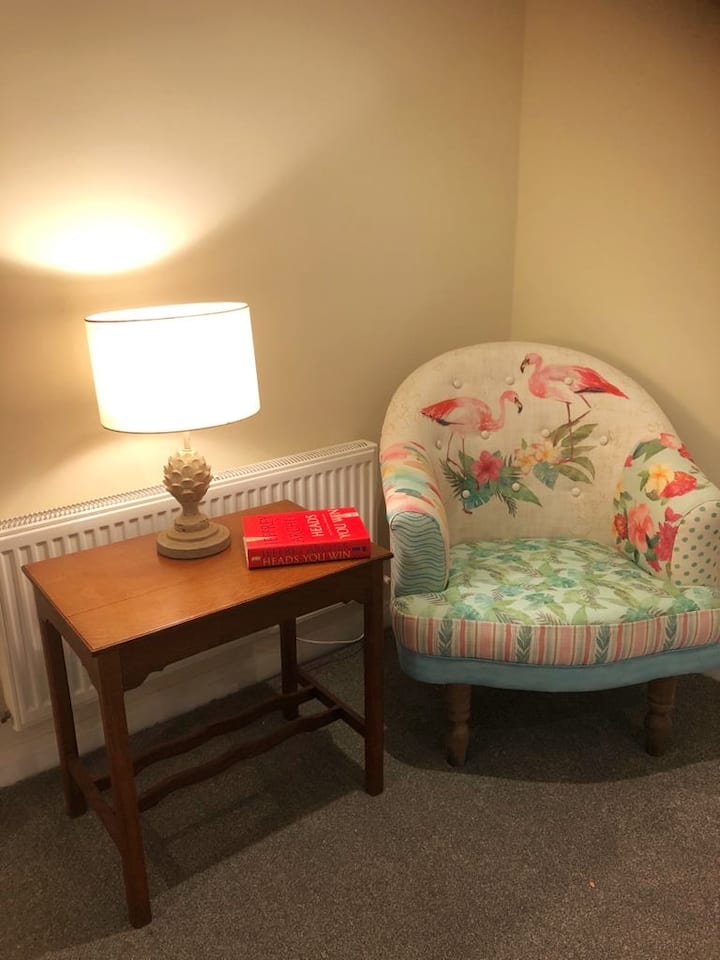 Relax with a book in the master bedroom