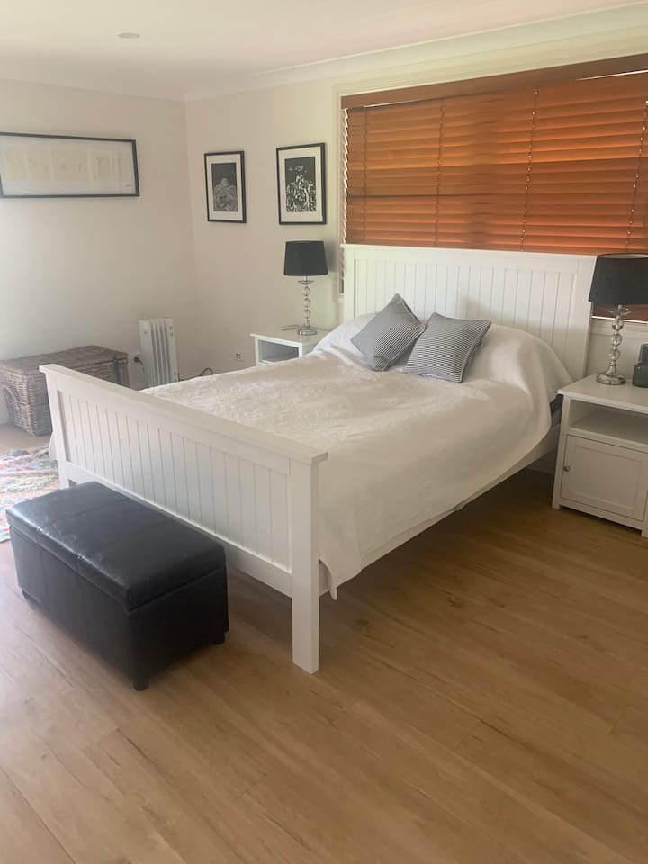 Queen size spacious bedroom with toilet and basin 