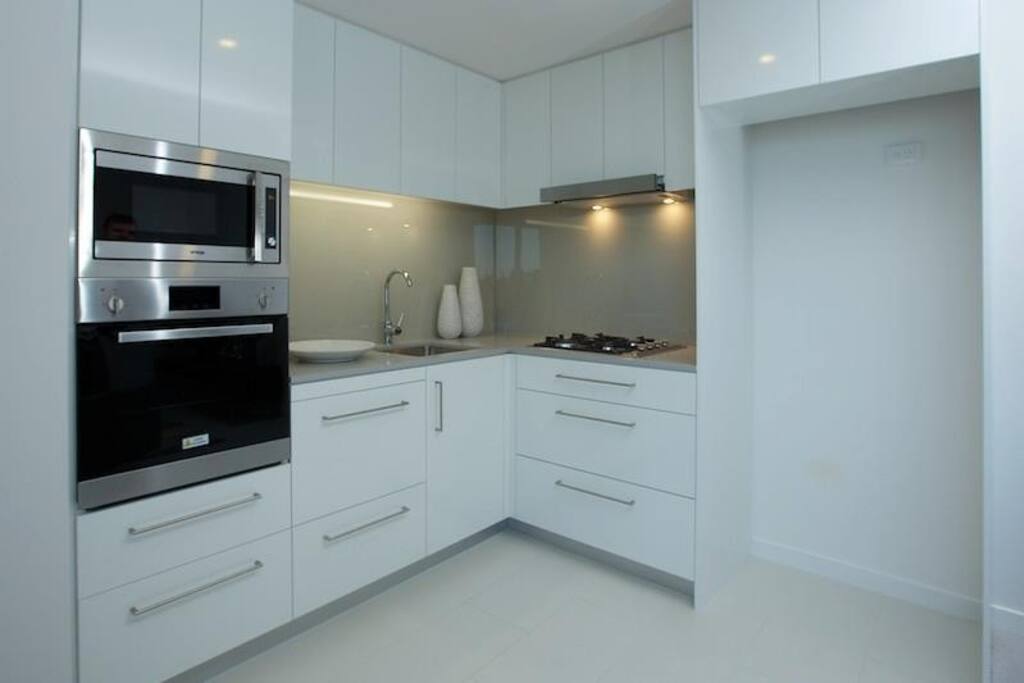 Kitchen with dishwasher, microwave, oven, stove top and fridge w/seperate freezer