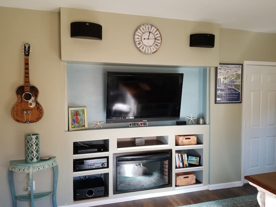 Living room/Surround Sound System with door to laundry