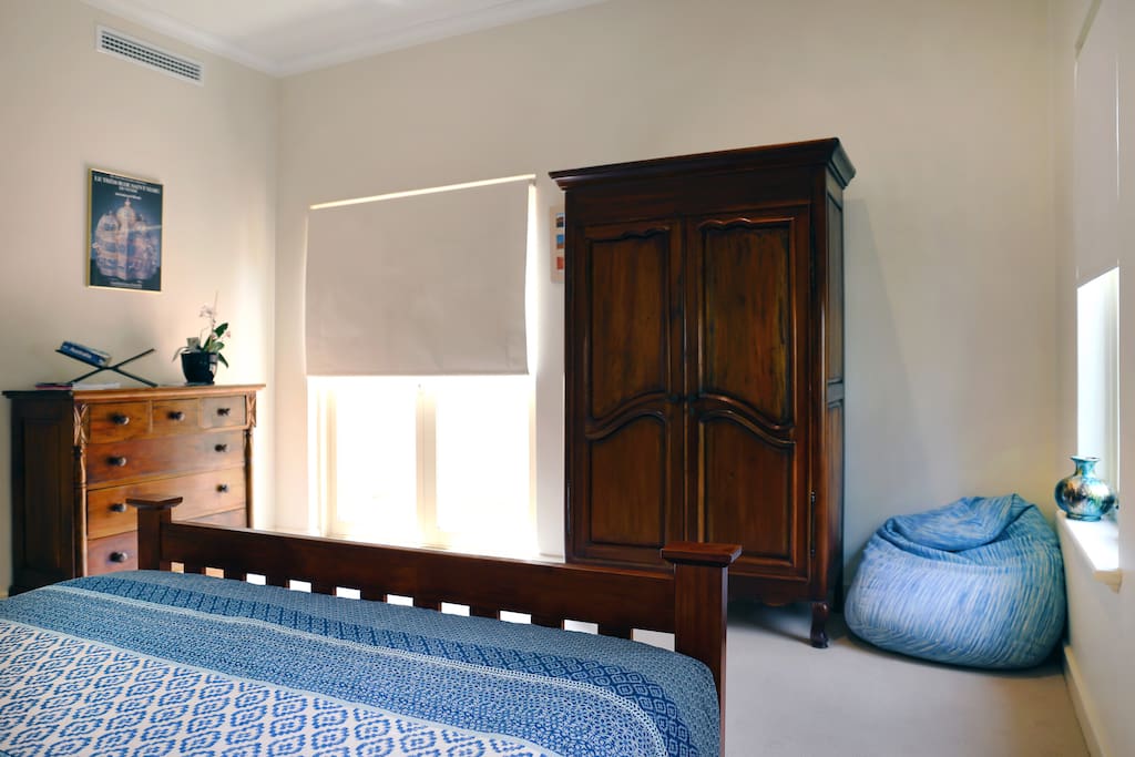 Chest of Drawers, Wardrobe, bean bag and private entry.