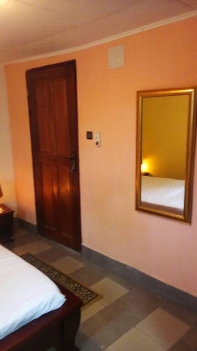 Bedroom door and mirror.