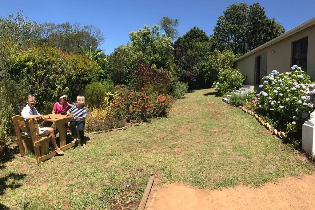 Breakfast area in indigenous garden and entrance to the guest suite.