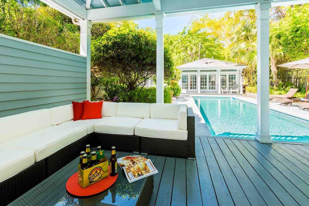 The home has a covered lanai, complete with an outdoor lounge area and bar...