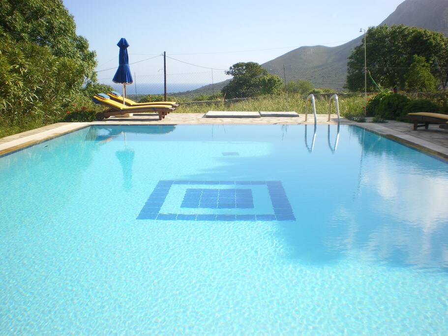 Panoramic sea and mountain views from the tranquil swimming pool and garden.