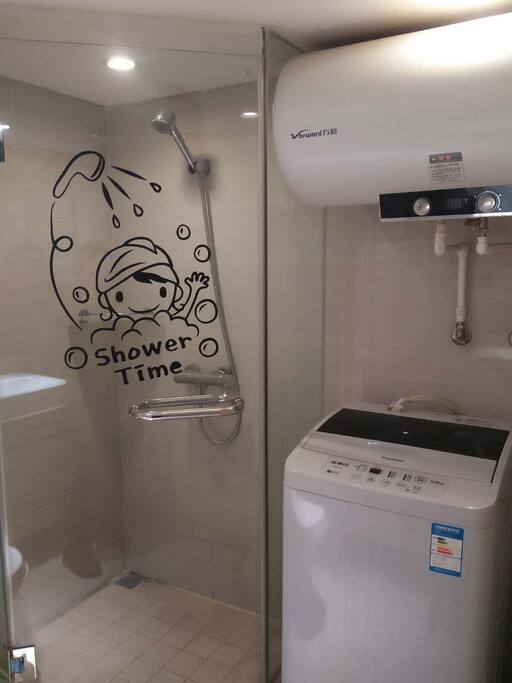 Bathroom with washing machine and shower
