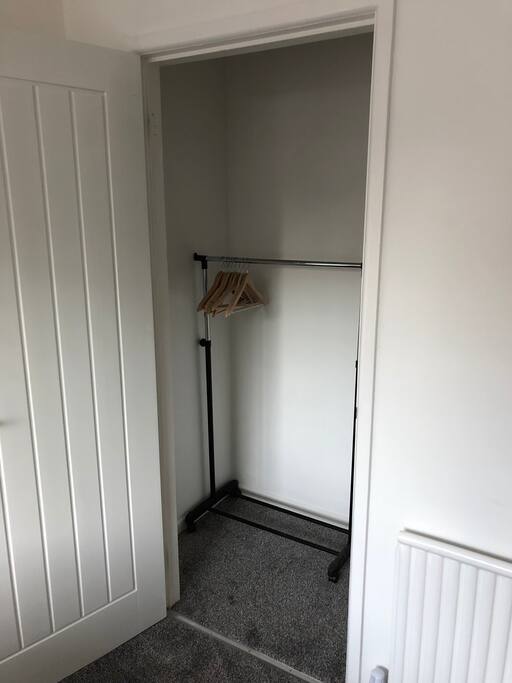 Storage cupboard in room with additional raised storage to the side