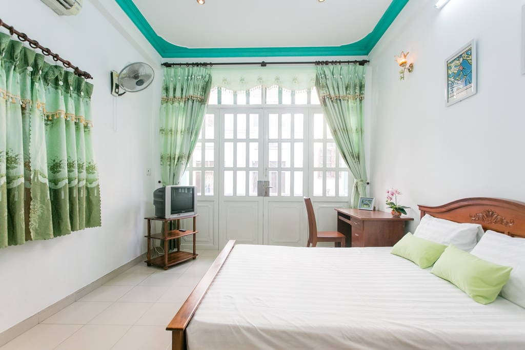 Balcony bedroom 1floor# with wooden furniture: big wardrobe, queen-sized bed, working desk and chair