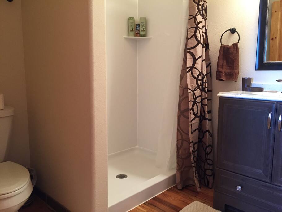 Now with full bathroom! Doored en suite bathroom with toilet, shower, sink and mirror. Towels, hair dryer, shampoo, conditioner, soap provided