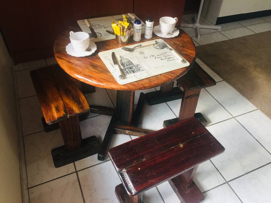 A table and 4 chairs in the main room