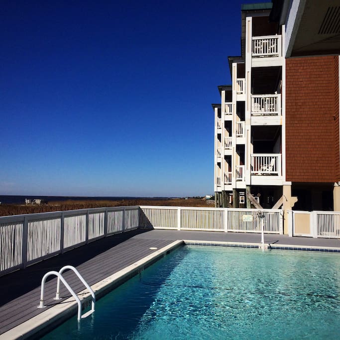 Pool overlooking the calm waters of the sound.
