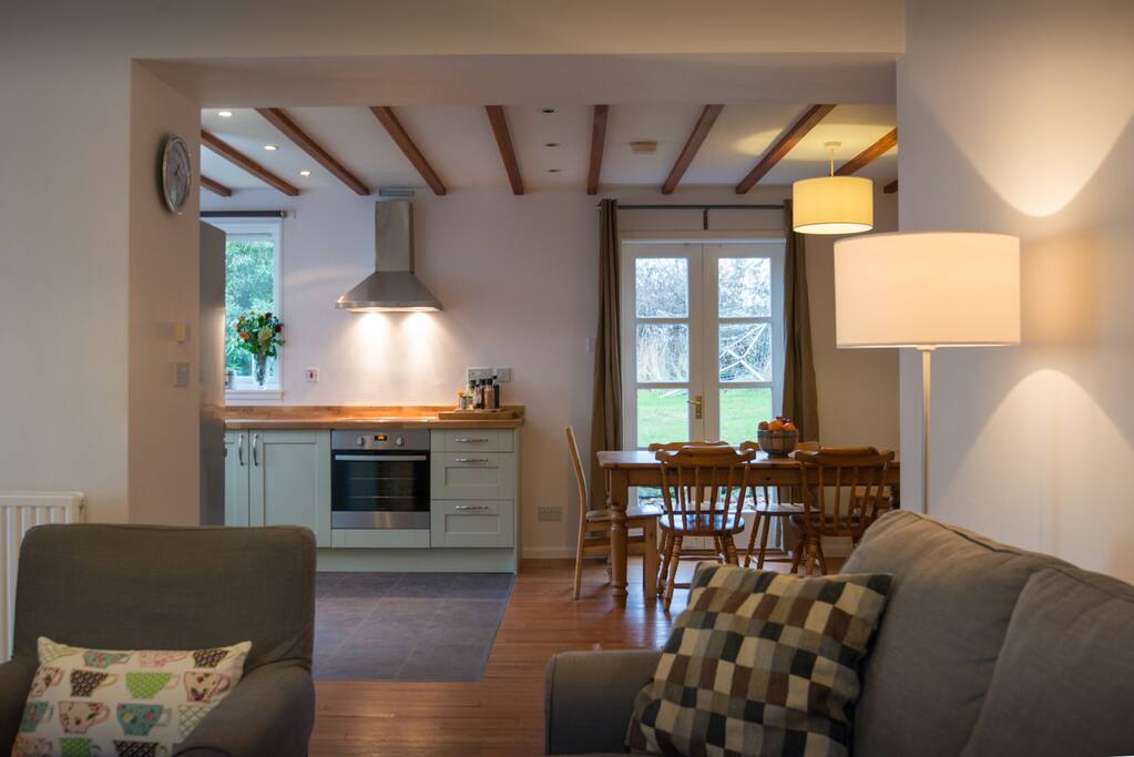 The new kitchen with dining table and living room