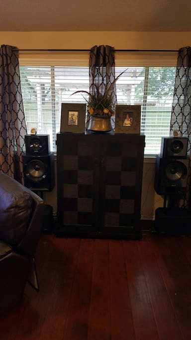 Cabinet with stereo console inside.
