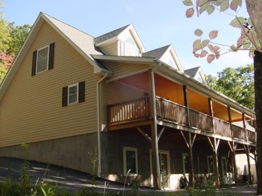 View of the back of our home. The apartment is located below the deck and you drive/park right at the door.