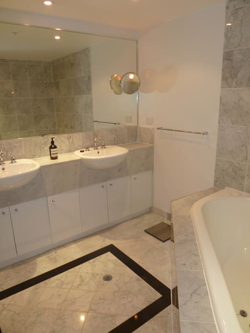 Main bathroom with shower and spa bath