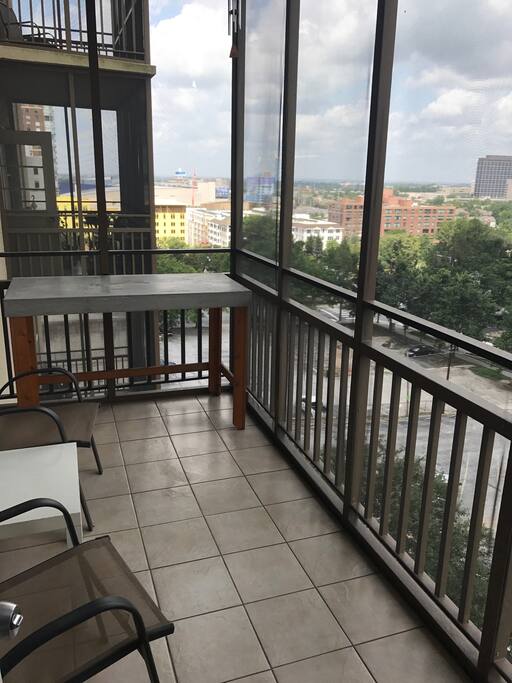 Relax on your own private balcony overlooking the city and the park