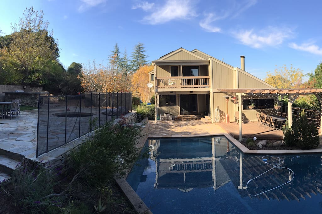 Backyard retreat with pool, deck, upper patio and BBQ