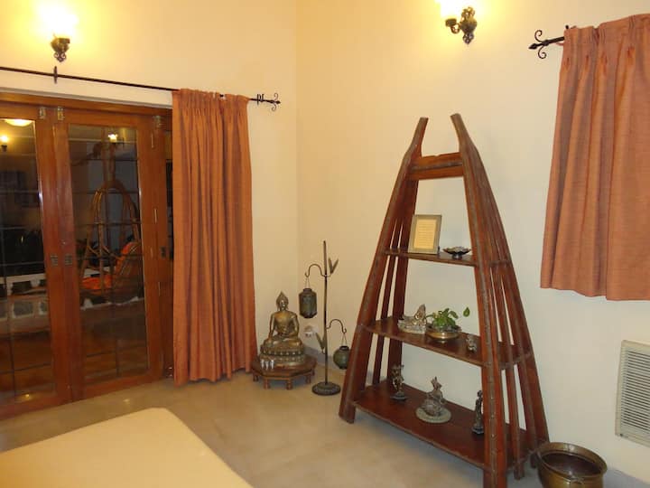 Bedroom 2 is furnished with a unique display unit which stands opposite the bed