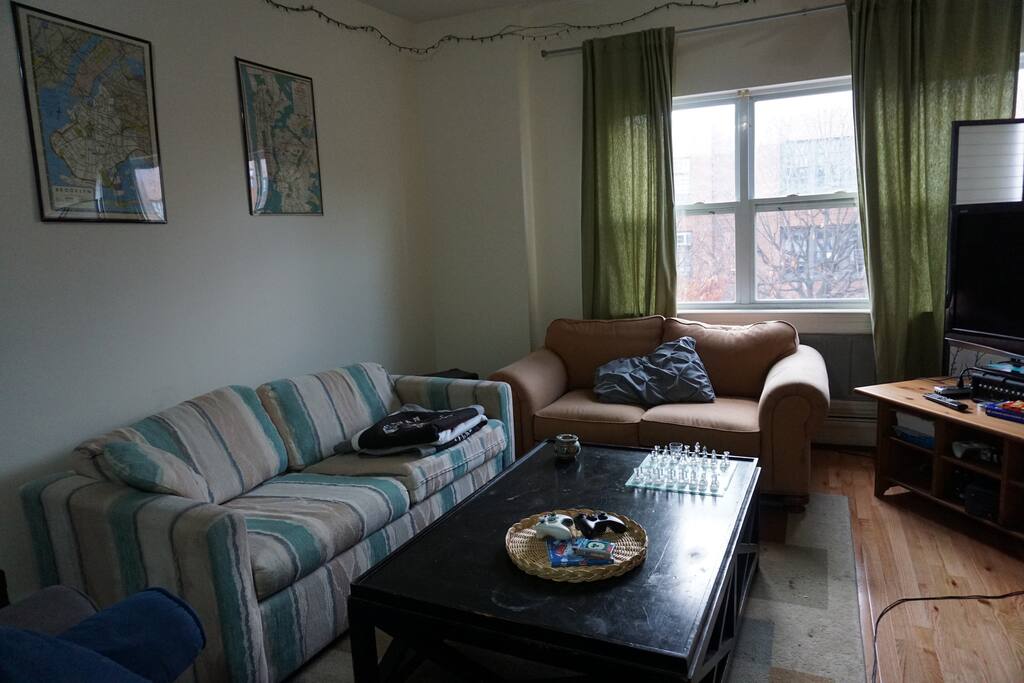 Three-Couch Living Room! Striped couch pulls out into a bed.