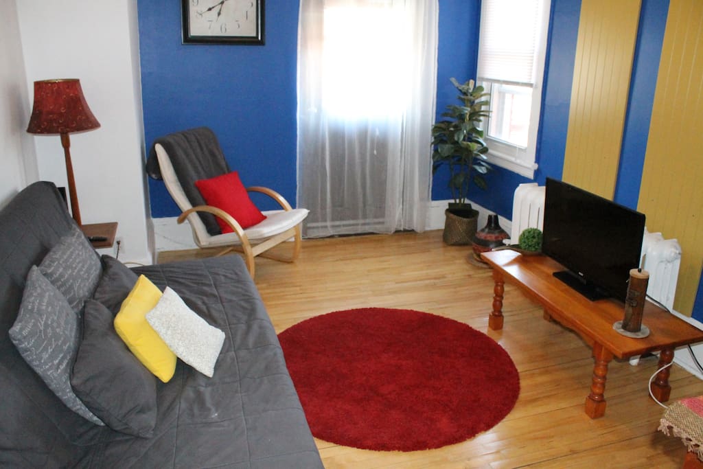 Living Room with Futon Sofa bed and Cable TV