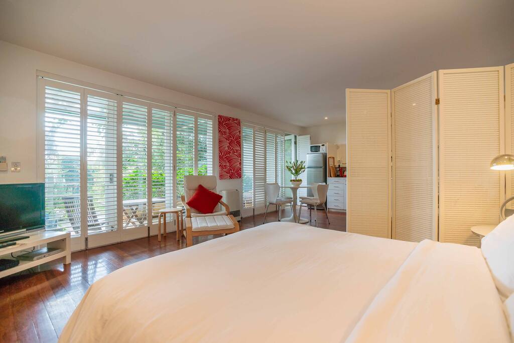 Lots of natural light, filtered through wall to ceiling shutters which adjust for light and privacy control. Two panels of glass louvres regulate fresh air.